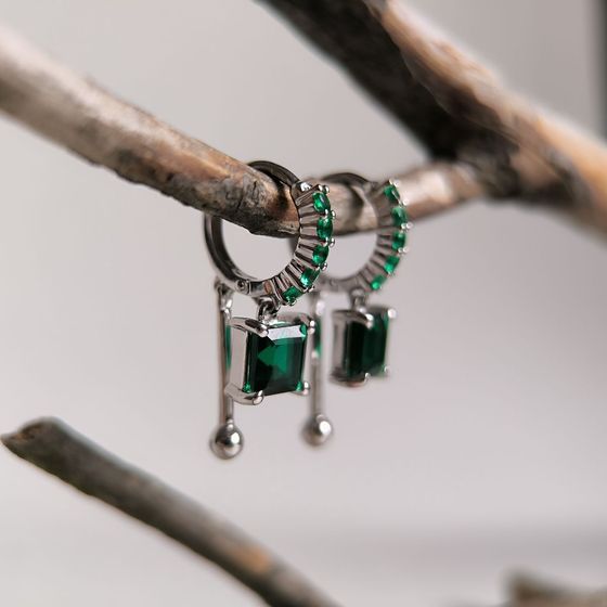 Silver earrings with a 2.295-carat nano emerald