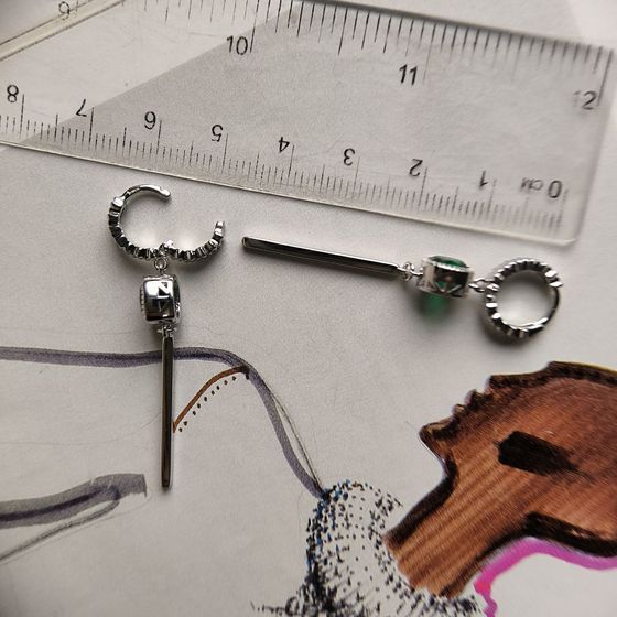 Silver earrings with a 1.892-carat nano emerald