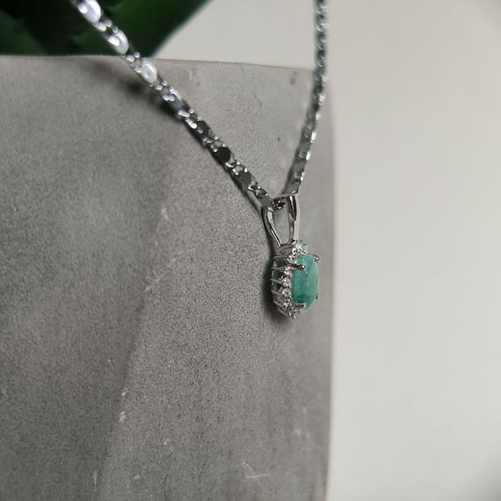 Silver pendant with a 0.907-carat emerald and cubic zirconia