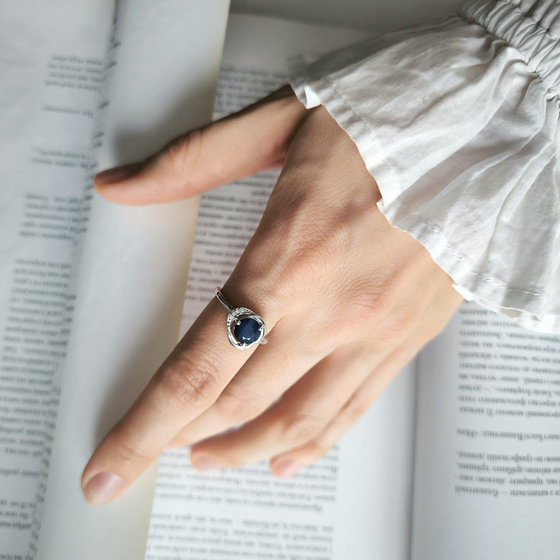 Silver ring with a sapphire and cubic zirconia