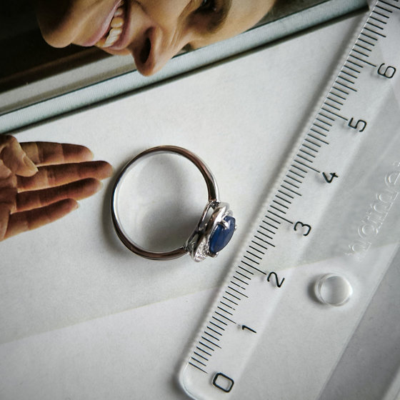 Silver ring with a sapphire and cubic zirconia