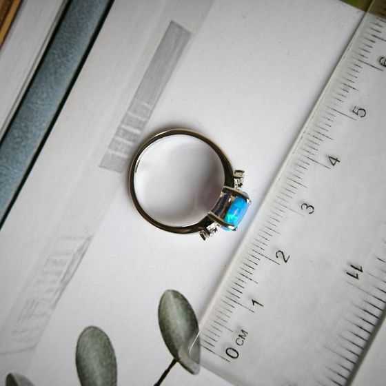 Silver ring with a 1.067-carat opal and cubic zirconia