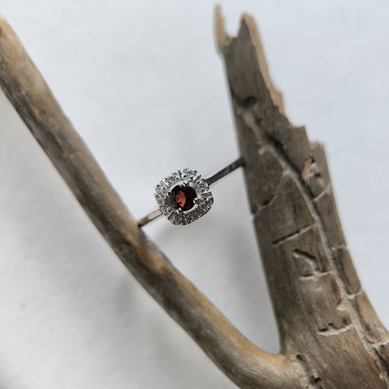 Silver ring with a 0.464-carat garnet and cubic zirconia