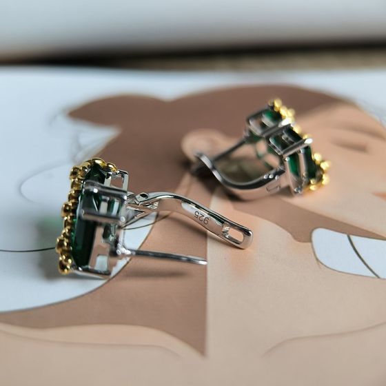 Silver earrings with a 5.963-carat nano emerald