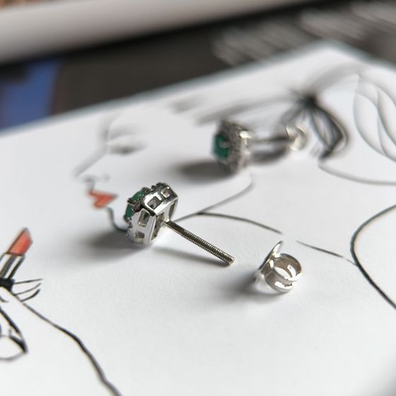 Silver earrings with a 0.682-carat emerald and cubic zirconia