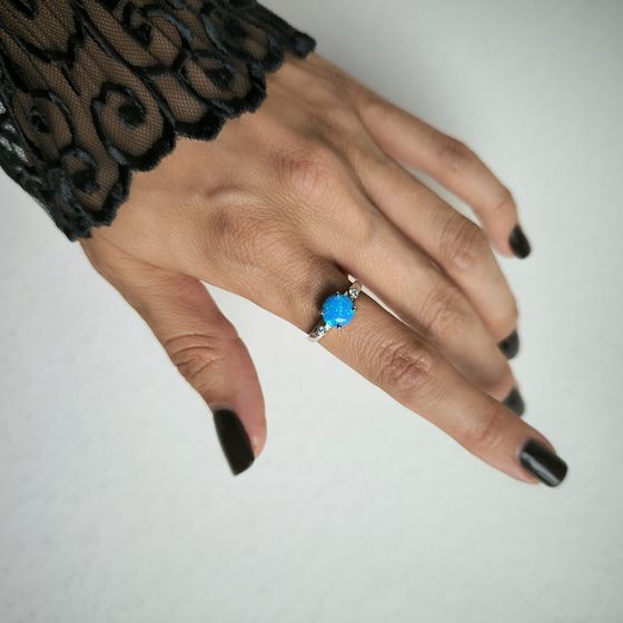 Silver ring with a 1.067-carat opal and cubic zirconia