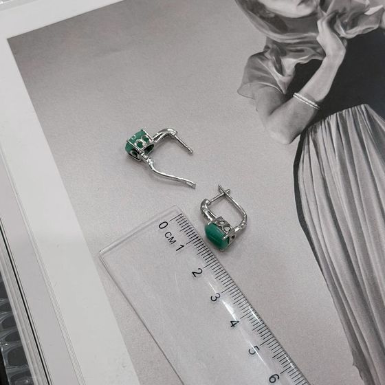 Silver earrings with a 4.782-carat emerald and cubic zirconia