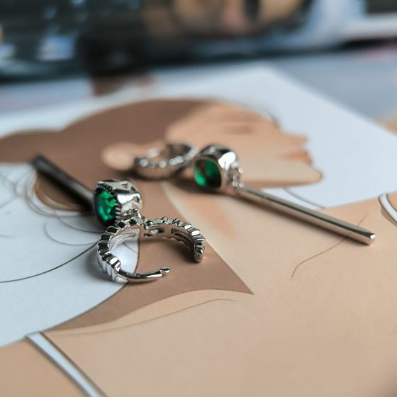 Silver earrings with a 1.892-carat nano emerald
