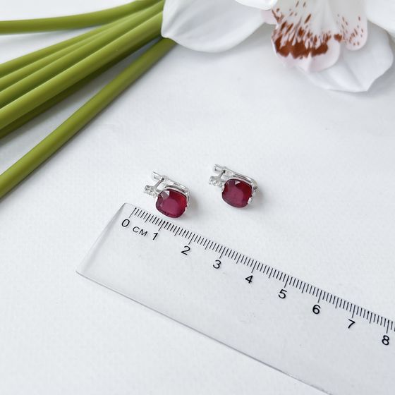 Silver earrings with a ruby