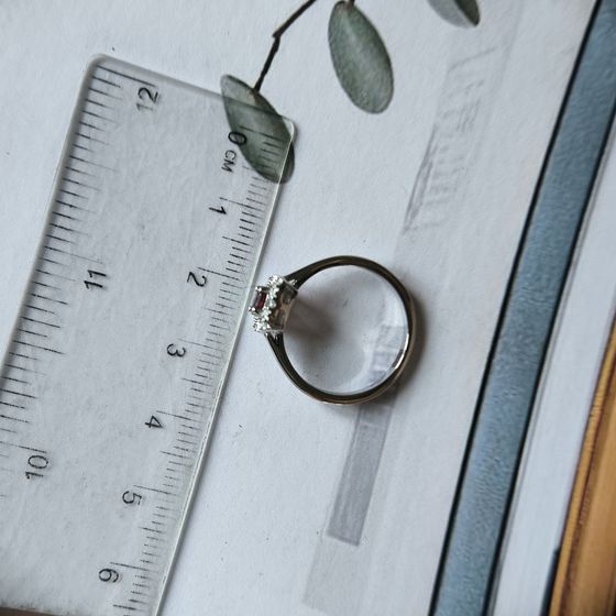Silver ring with a 0.464-carat garnet and cubic zirconia