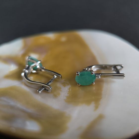 Silver earrings with a 1.605-carat emerald and cubic zirconia
