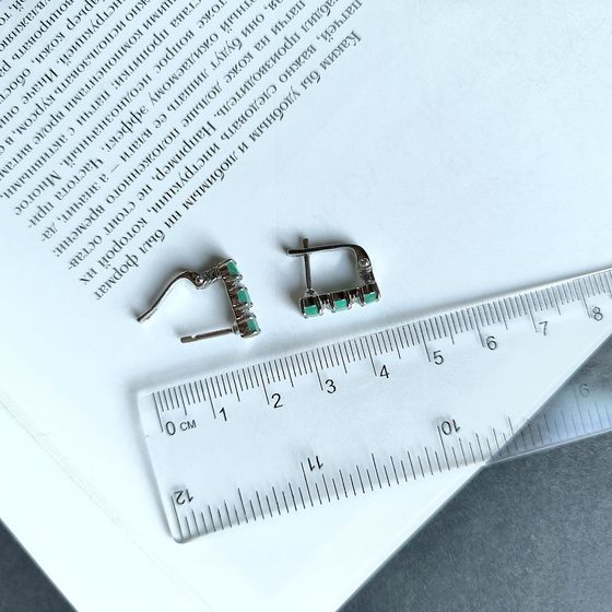 Silver earrings with a 2.006-carat emerald and cubic zirconia