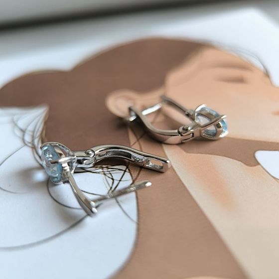 Silver earrings with a 1.874-carat topaz and cubic zirconia