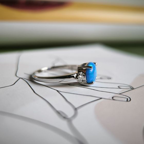 Silver ring with a 1.067-carat opal and cubic zirconia