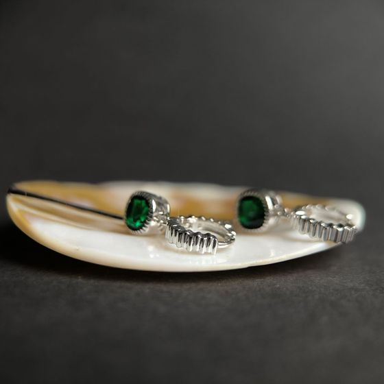 Silver earrings with a 1.892-carat nano emerald