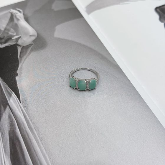 Silver ring with emerald, fianites