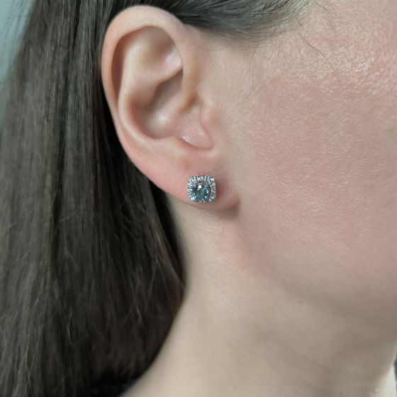Silver earrings with a 0.648-carat mystic topaz