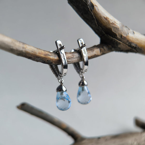 Silver earrings with a 9.483 ct topaz and cubic zirconia