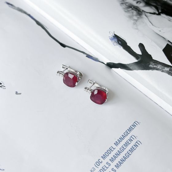 Silver earrings with a ruby