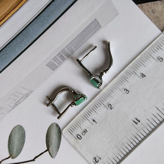 Silver earrings with emerald, fianites