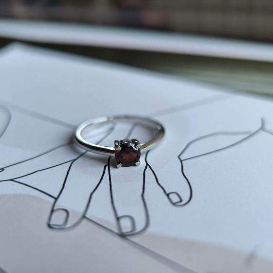 Silver ring with a 0.595-carat garnet