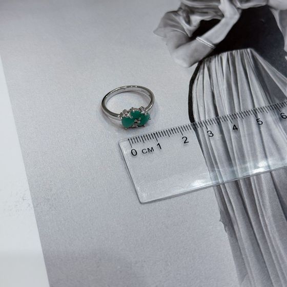 Silver ring with emerald, fianites