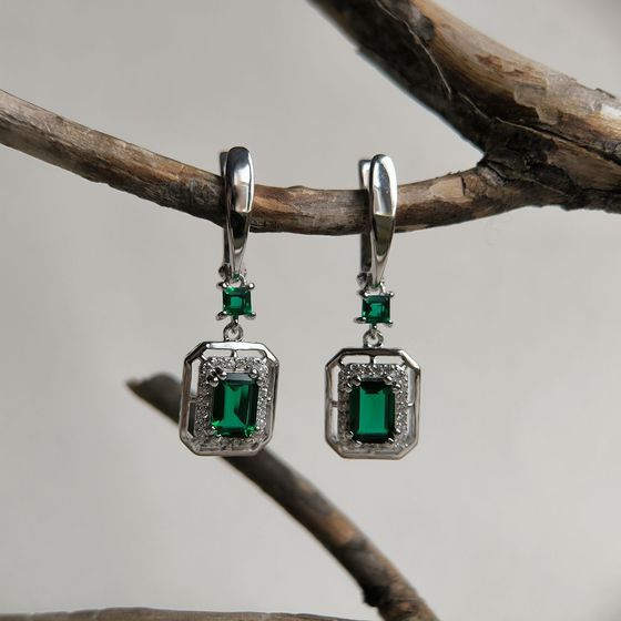 Silver earrings with a 2.367-carat nano emerald