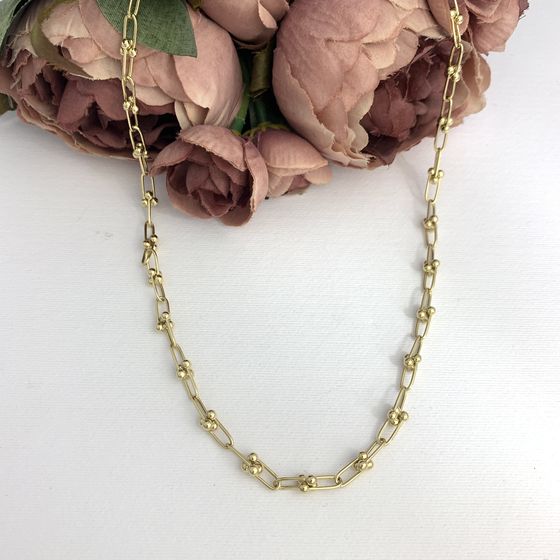 A gold necklace without stones
