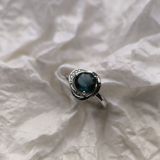 Silver ring with a London Blue topaz and cubic zirconia