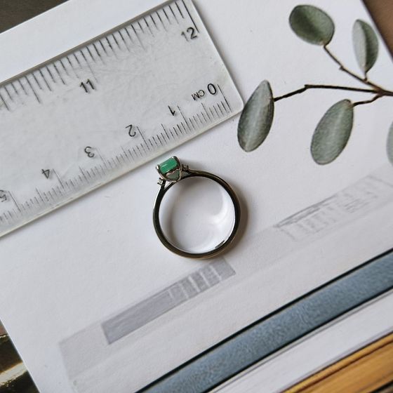 Silver ring with a 0.743-carat emerald and cubic zirconia