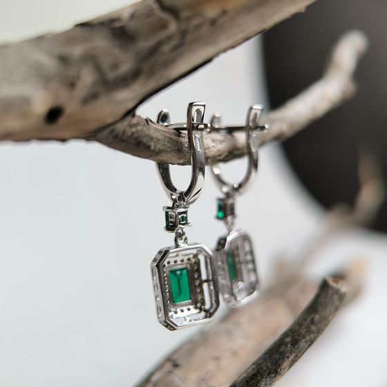 Silver earrings with a 2.367-carat nano emerald