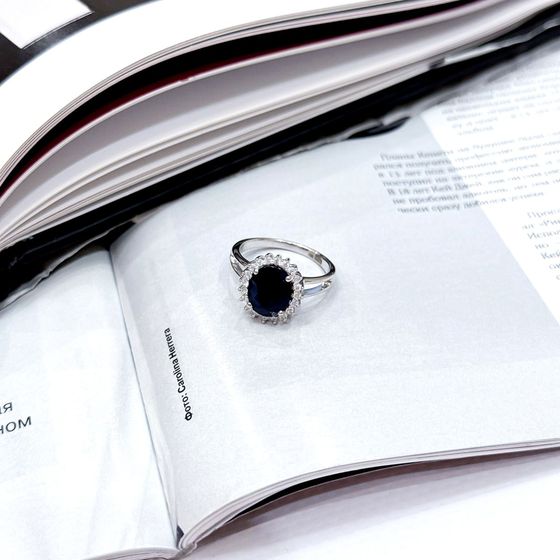 Silver ring with a sapphire and cubic zirconia