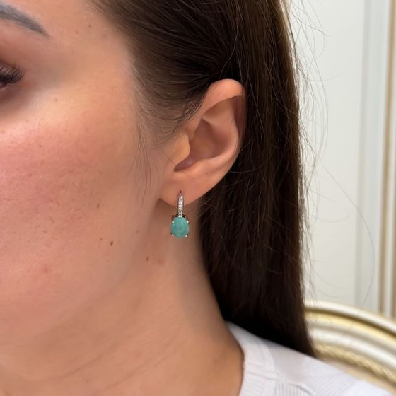Silver earrings with a 4.782-carat emerald and cubic zirconia