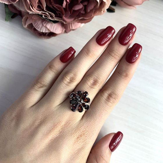 Silver ring with a garnet