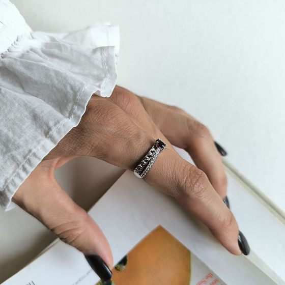 Sterling silver ring with 0.643ct garnet and fianites
