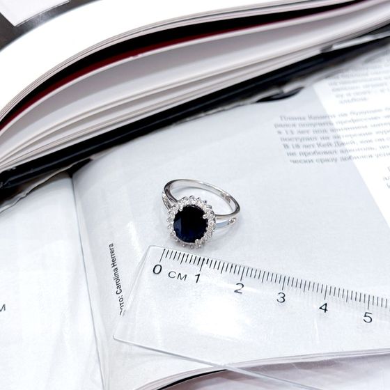 Silver ring with a sapphire and cubic zirconia