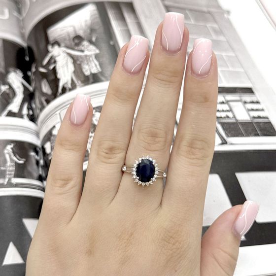 Silver ring with a sapphire and cubic zirconia