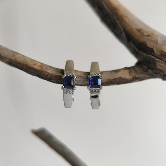 Silver earrings with a 0.889-carat sapphire and cubic zirconia