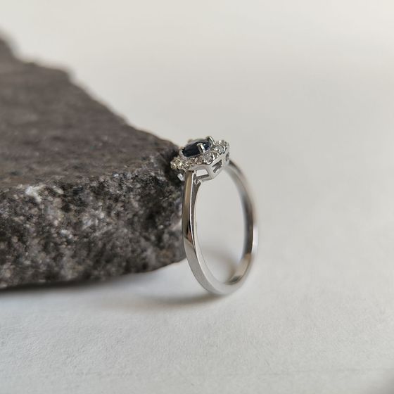 Silver ring with a 0.525-carat sapphire and cubic zirconia