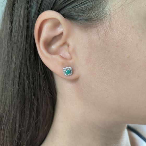 Silver earrings with a 0.682-carat emerald and cubic zirconia