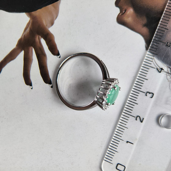 Silver ring with a 2.836-carat emerald and cubic zirconia