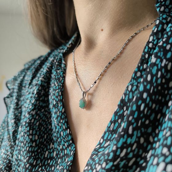Silver pendant with a 0.907-carat emerald and cubic zirconia