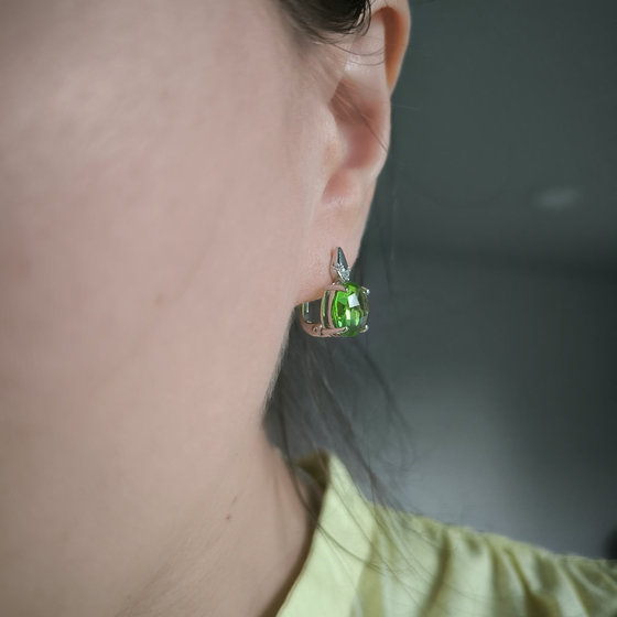 Silver earrings with a 6.685-carat chrysolite and cubic zirconia