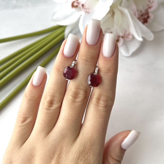 Silver earrings with a ruby