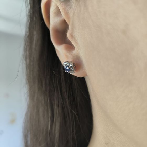 Silver earrings with a 1.028-carat sapphire and cubic zirconia