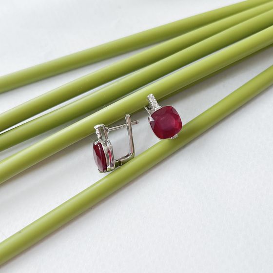 Silver earrings with a ruby