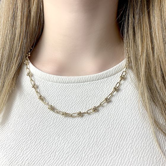 A gold necklace without stones