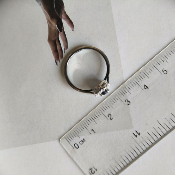 Silver ring with a 0.525-carat sapphire and cubic zirconia