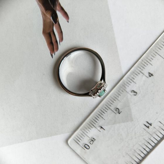 Silver ring with a 0.36-carat emerald and cubic zirconia