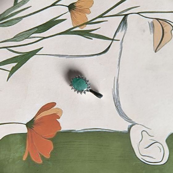 Silver pendant with emerald, fianites